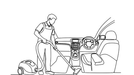 Man vacuuming car interior with cleaning equipment