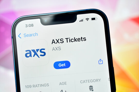 Closeup of axs tickets app on smartphone screen with colorful blurred background