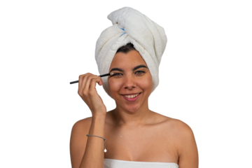 Young woman applying eyeshadow with makeup brush