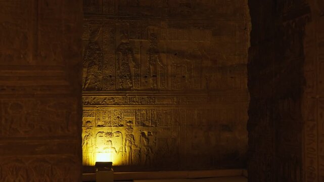 Ancient hieroglyphic carvings on the walls of the temple in Dendera or the temple of Hathor in Egypt. The ancient civilization of the Pharaohs of Egypt.