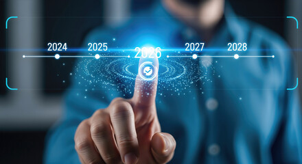 Fototapeta premium Businessman touching a virtual timeline to select the year 2026 on a futuristic digital interface with glowing blue graphics.
