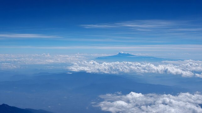 Clouds covering andes mountains, cayambe volcano peaking above the stratospheric horizon, aerial ecuador landscape view