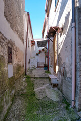 A narrow street among the old houses of Raviscanina, a small town in the province of Caserta, Italy.