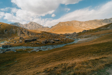 Fototapeta premium River coming from Kel-Suu mountain range, Kurumduk valley, Naryn province, Kyrgyzstan, Central Asia