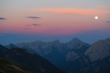 Spectacular sunset over the Karwendel mountains, with glowing peaks and dramatic alpine light.