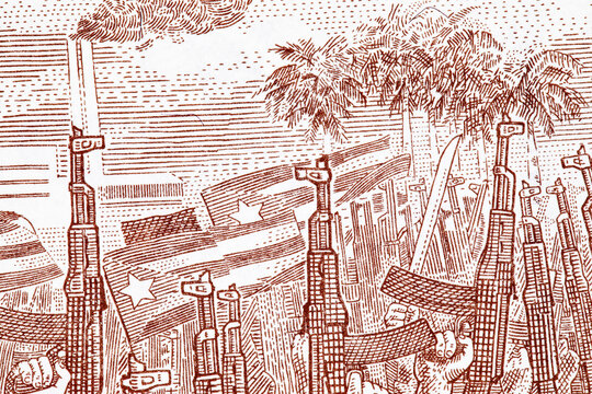 10 Pesos Cuba image of national flags and soldiers with Kalashnikov assault rifles. Paper money Cuba.