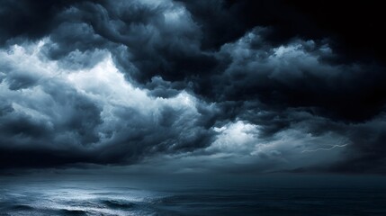 Obraz premium Dark storm clouds gathering over a restless ocean with flashes of lightning illuminating the turbulent weather