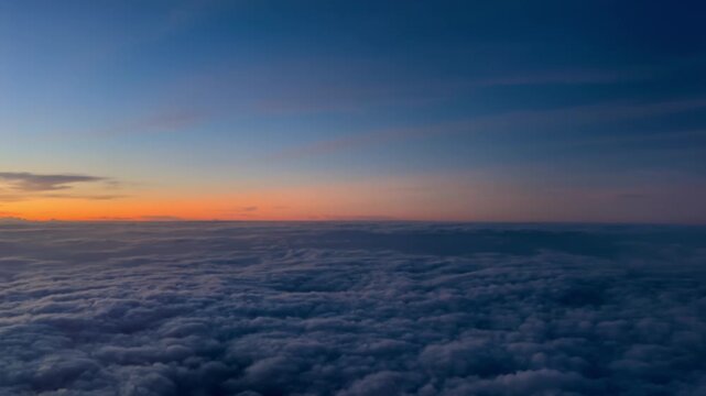 Aerial View of Cloudy Sky from Airplane Window