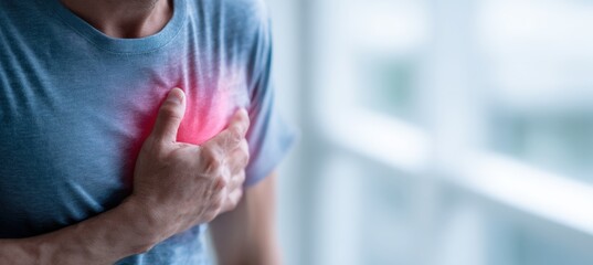 Man Experiencing Chest Pain in Bright Room for Health Awareness Concept