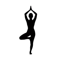 Fototapeta premium A silhouette of a person balancing in a yoga tree pose