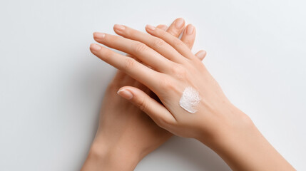 A woman's hand is covered in lotion