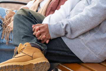 Married couple holding hands with wedding rings on Valentine's Day