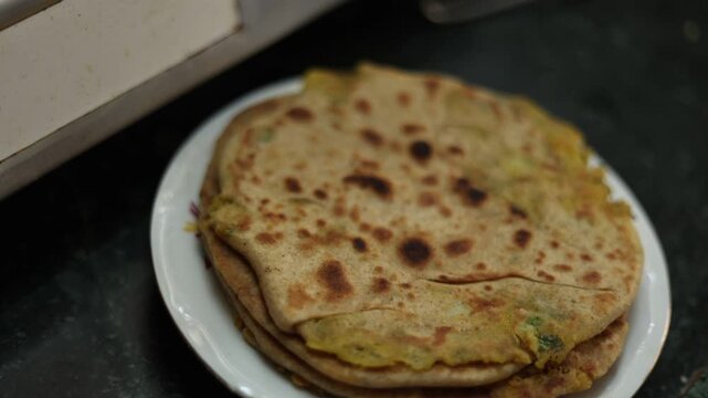 Homemade Aloo paratha in an Indian kitchen 