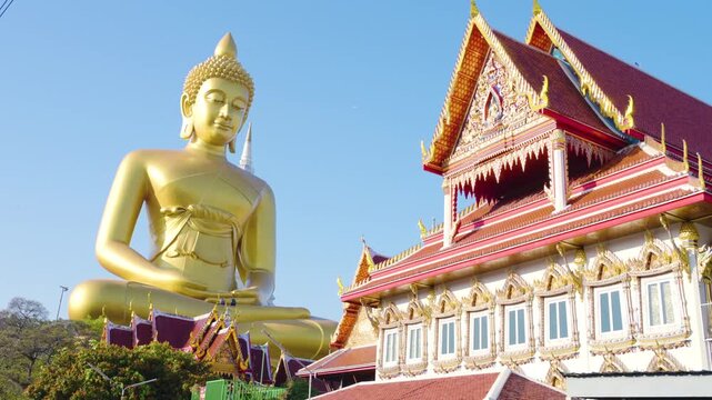 Wat Paknam Bhasicharoen temple big gold buddha statue with wooden tradition travel boat in Bangkok, Thailand