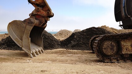 excavator bucket and crawler in mine