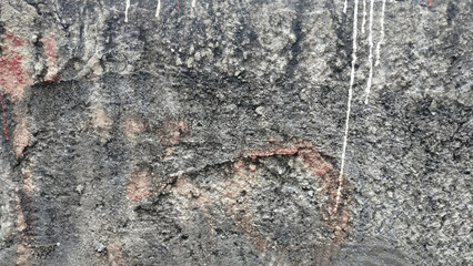 The concrete ground is bumpy and rough to the touch