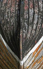 wooden row boat turned upside down