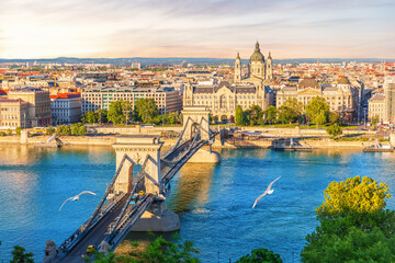 Skyline panorama of Budapest Chain Bridge over blue Danube with St. Stephen's basilica view, Hungary