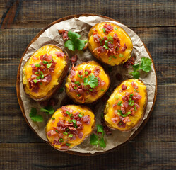 Delicious baked stuffed potatoes with bacon, green onion and cheddar cheese
