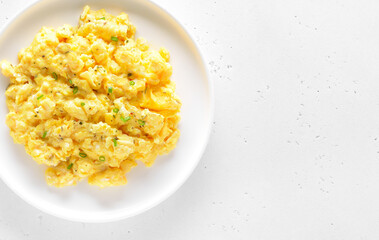 Delicious scrambled eggs on plate