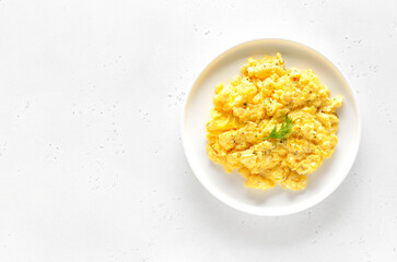 Delicious scrambled eggs on plate