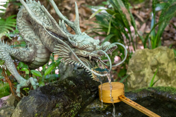Bronze dragon chozuya at Mitaki-Dera temple in Hiroshima, Japan