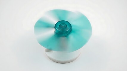 Spinning Teal Fan with Motion Blur on White Background