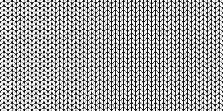 Close up of a monochrome knit fabric texture with a repeating pattern