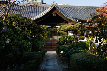 Fototapeta premium Osaka. Traditional Japanese House with Wooden Sliding Doors, Garden Path, and Stone Steps