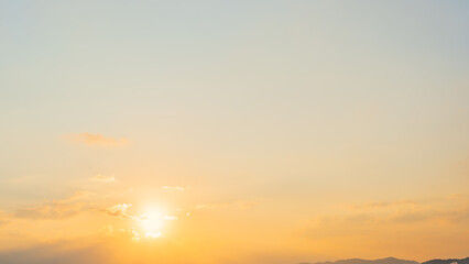 Golden sunset sky background, Yellow Sun sky clouds in the Evening summer season golden hour well nature banner background