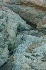 Rock formations with a little stream through it.