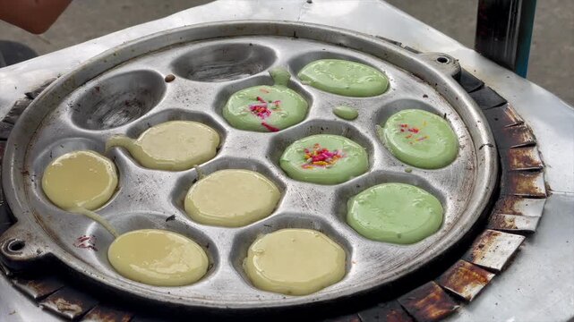 Video making kue cubit (mini pancake) with colorful sprinkles topping