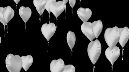 Silver heart shaped balloons float up against black background