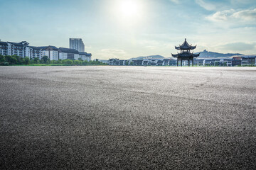 Fototapeta premium Tranquil Urban Landscape Featuring Traditional Pavilion Amidst Modern Architecture