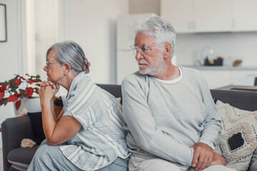 Divorce, senior woman and fight or sad in marriage in living room with partner or angry in home....