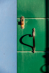 An artistic door handle with shadows, Venice, Italy