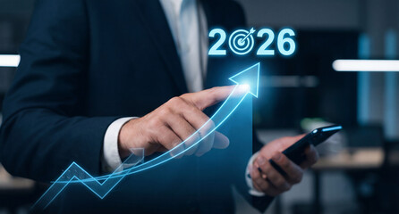 Businessman using a virtual touchscreen interface to interact with digital business technology and growth target in 2026 generative ai