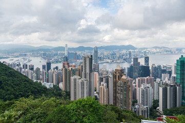 Fototapeta premium View of Hong Kong and Kowloon from Victoria peak. Panorama of Hong Kong, skyscrapers and nature. 21 May 2025, Hong Kong, China