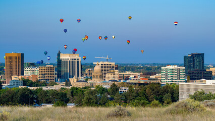 City skyline with balloons launched above