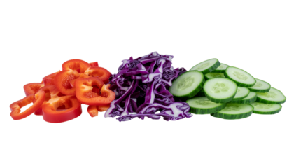 A fresh organic salad of raw cabbage cucumber and bell peppers is isolated on a white background as a healthy vegetarian meal ingredient