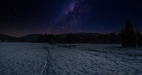 Fantasy scenic snowy winter mountain landscape in the evening, stars in the sky, Creative post...