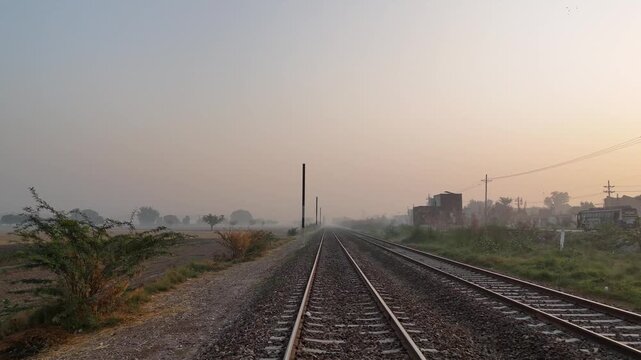 Railway Track Drone footage flying along the track on a drone. High quality 4k footage FPV drone footage of a moving train on railway tracks, shot from above. Captures dynamic motion and railway line