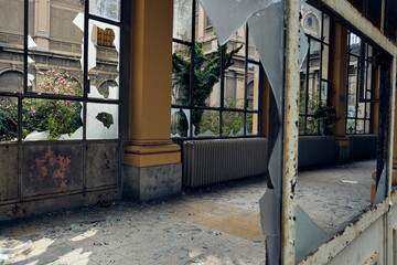 Abandoned hospital courtyard with classical architecture