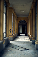 Abandoned hospital courtyard with classical architecture