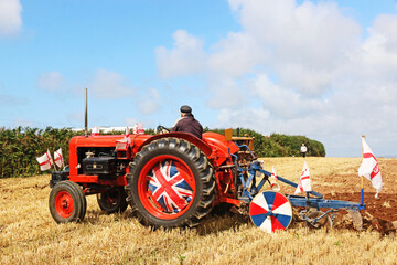 Vintage tractor ploughing a field	
