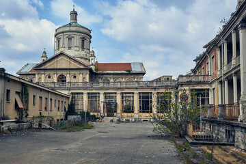 Abandoned historic hospital with domed roof