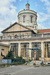 Abandoned historic hospital with domed roof