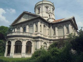 Abandoned historic hospital with domed roof