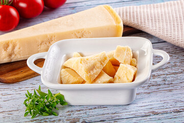 Parmesan cheese pieces in the bowl