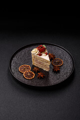 A slice of sweet layered cake with white cream for a birthday or holiday. A slice of cake